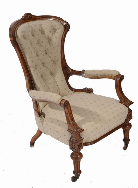 Appraisal: A VICTORIAN WALNUT FRAMED OPEN ARMCHAIR with shaped and carved