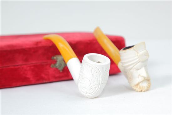 Appraisal: TWO MEERSCHAUM PIPES One with carved fruit and foliate decoration