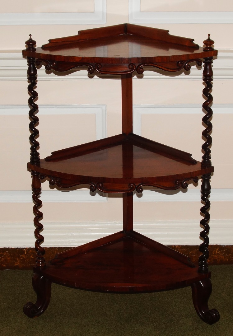 Appraisal: A Victorian rosewood corner whatnot of three levels with barleytwist