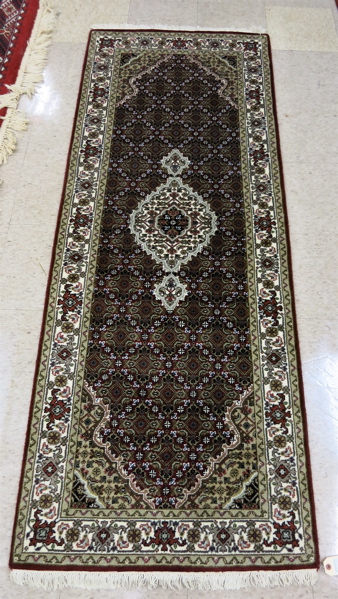 Appraisal: HAND KNOTTED ORIENTAL AREA RUG Persian Bidjar design featuring a