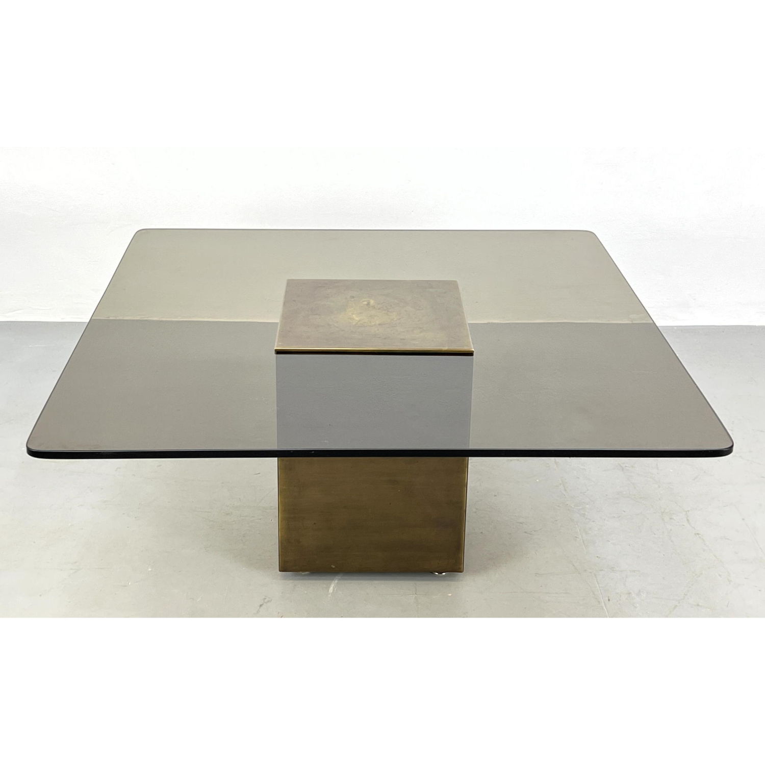 Appraisal: YAMASAKI glass and bronze cocktail coffee table Dimensions H inches