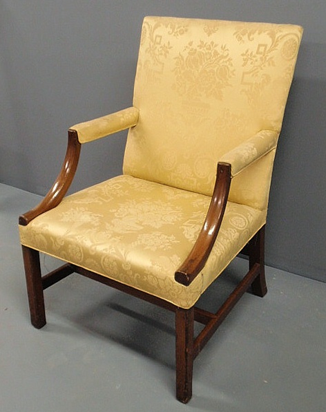 Appraisal: Chippendale style mahogany lolling chair with square legs joined by