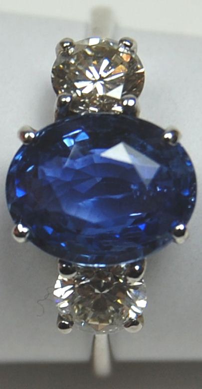 Appraisal: An ct white gold mounted sapphire and diamond three-stone ring