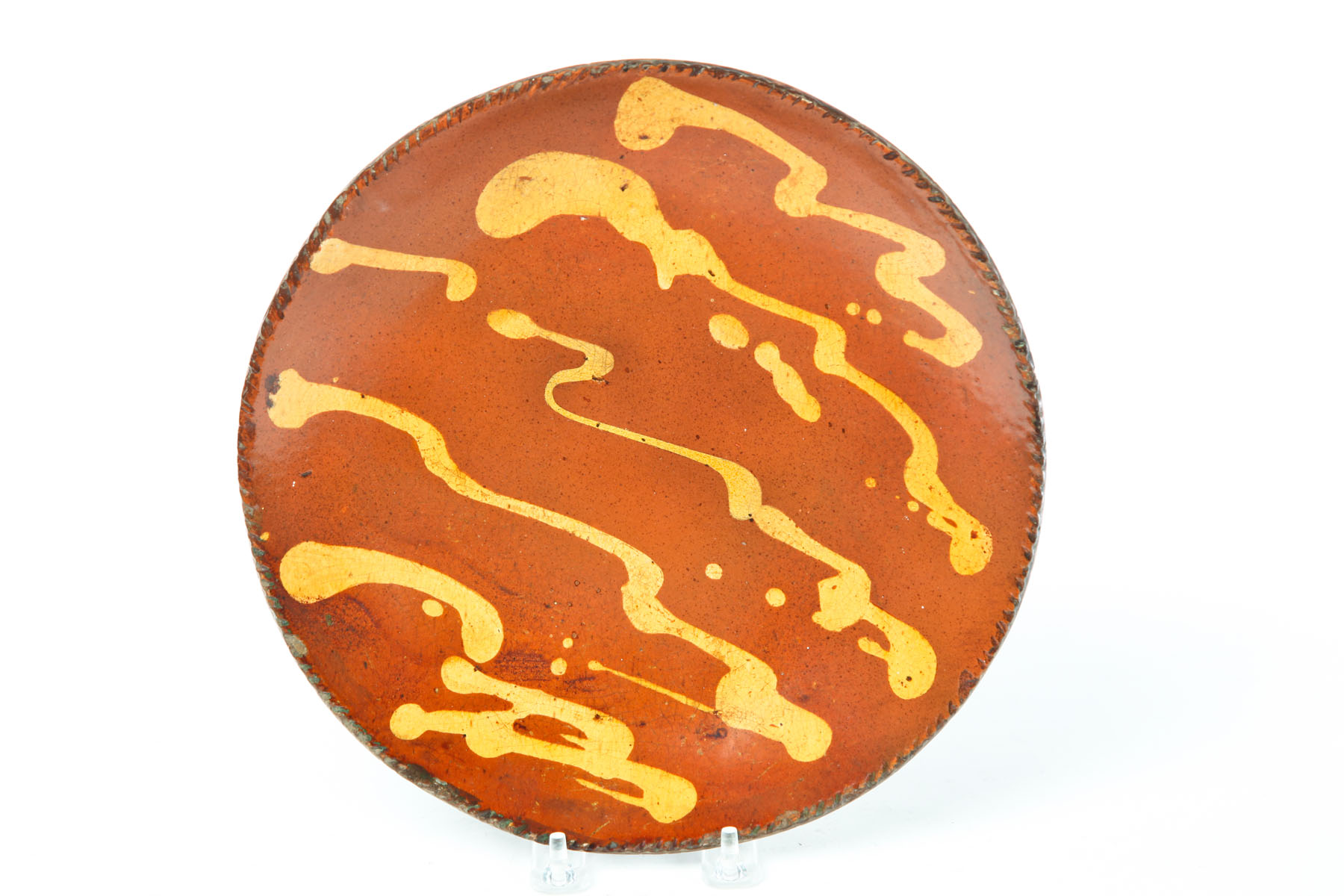 Appraisal: REDWARE PIE PLATE American mid th century Coggled rim and