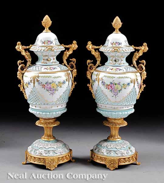 Appraisal: A Pair of Sevres-Style Gilt and Polychrome Urns mid- th