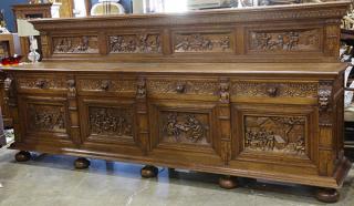 Appraisal: Renaissance Revival style quatersawn-oak figural buffet the traditional case fitted