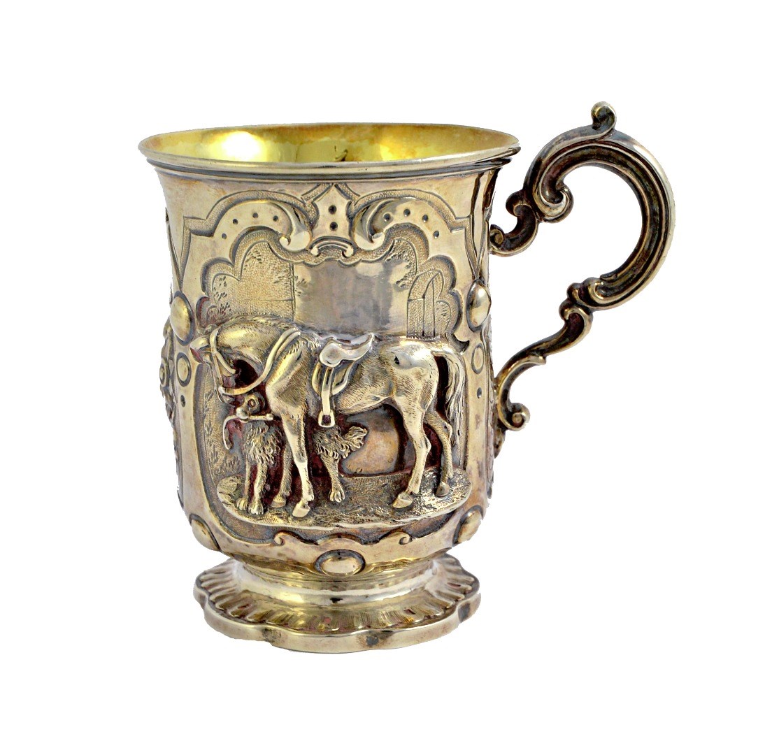 Appraisal: A Victorian silver christening mug decorated with a horse and