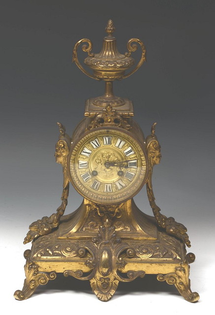 Appraisal: A FRENCH GILT METAL MANTEL CLOCK with drum dial mounted