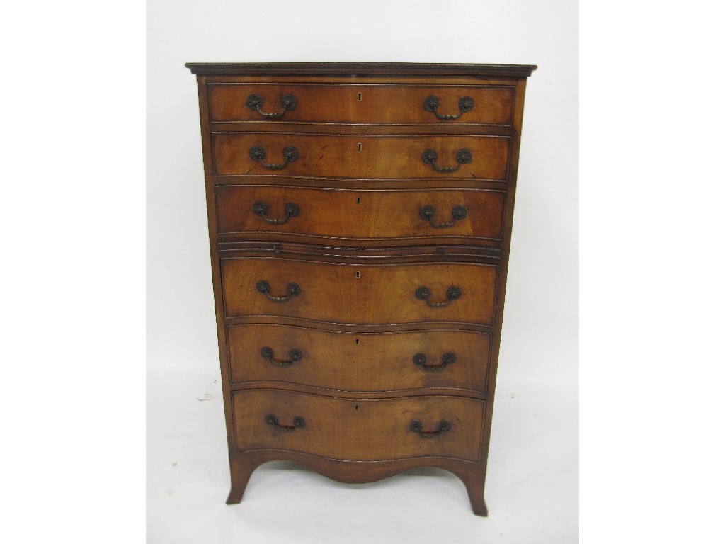 Appraisal: An reproduction Georgian style mahogany serpentine shaped chest of drawers