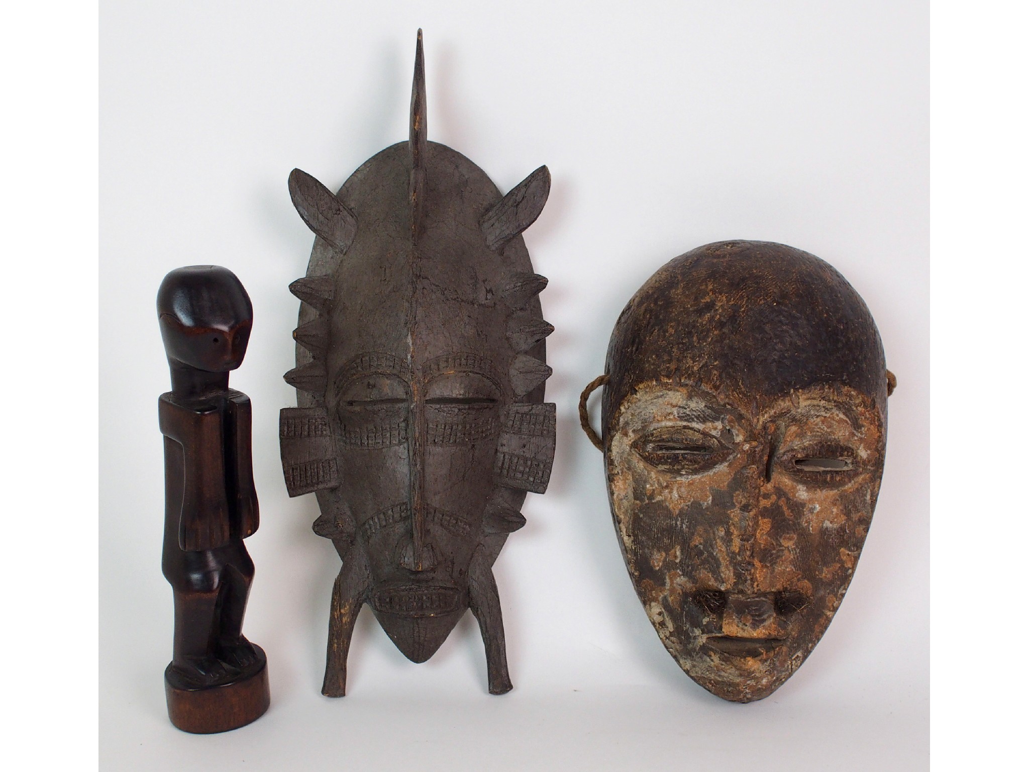 Appraisal: An African possibly Fang carved maskthe patinated face with slit