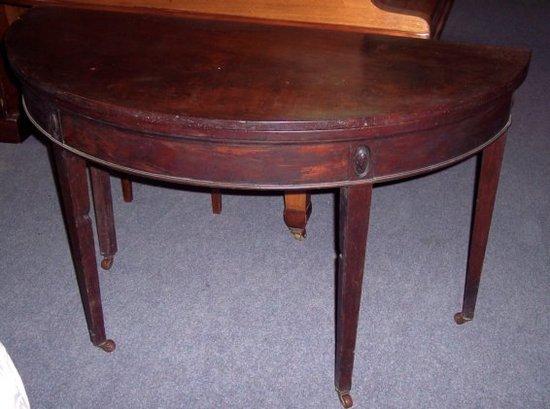 Appraisal: A Regency mahogany D shaped card table circa on turned