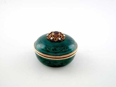 Appraisal: A continental silvergilt and emerald green-enamelled dressing table box and