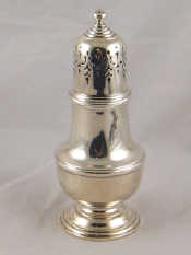 Appraisal: A sterling silver sugar caster in the George II manner