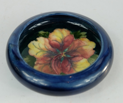 Appraisal: Moorcroft footed dish decorated in the Columbine design diameter cm