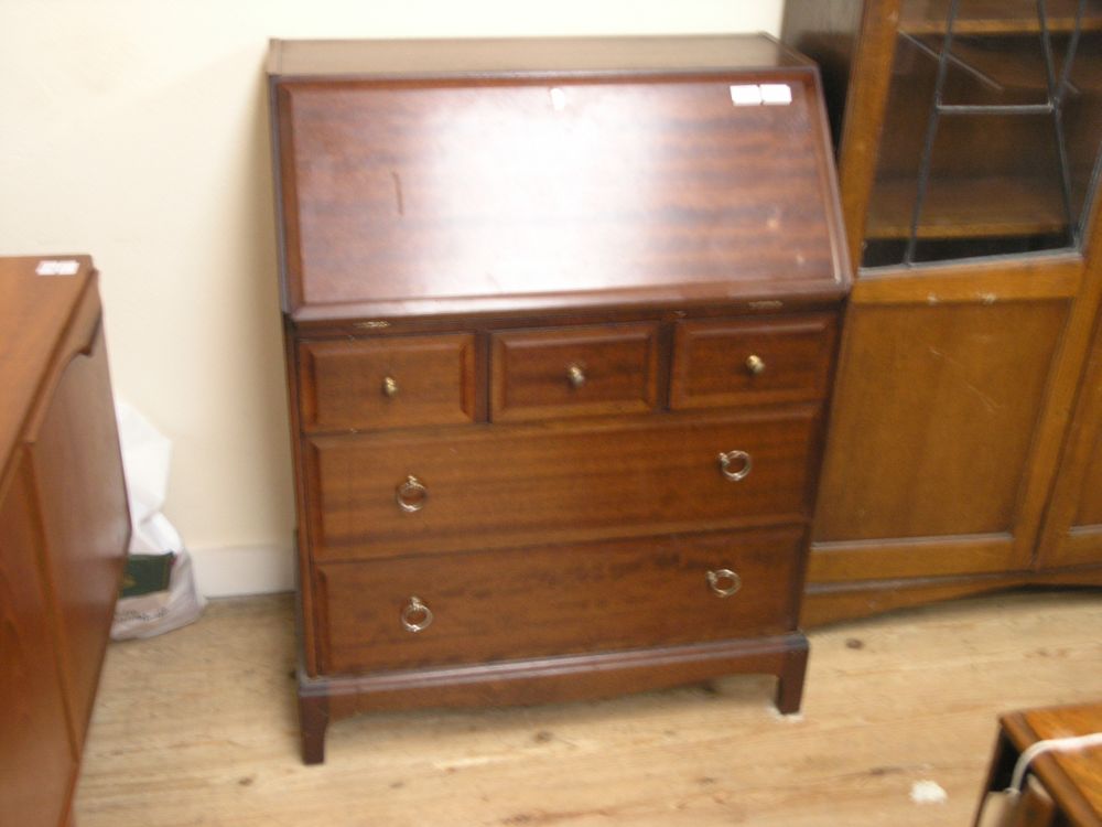 Appraisal: A Stag mahogany bureau fall-front enclosing fitted interior above three