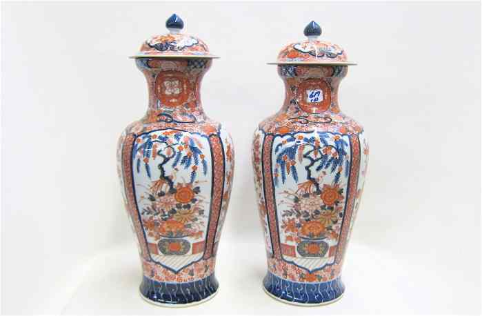 Appraisal: PAIR JAPANESE IMARI PORCELAIN COVERED JARS having matching cartouches of