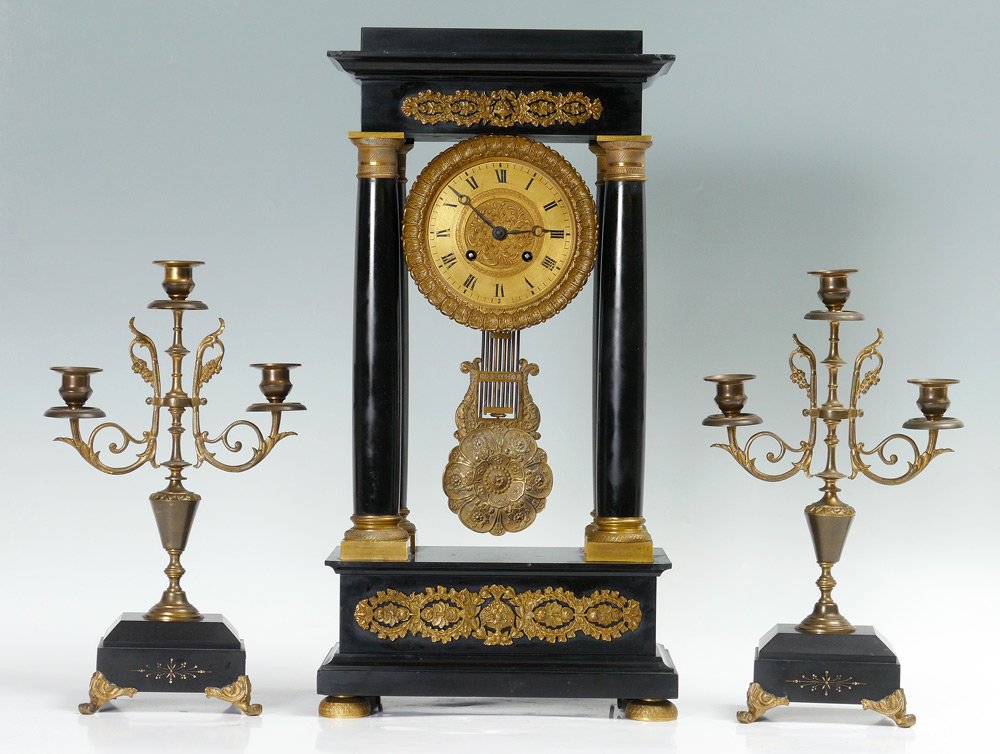 Appraisal: CONTINENTAL BLACK PORTICO CLOCK GARNITURE Portico clock with black slate