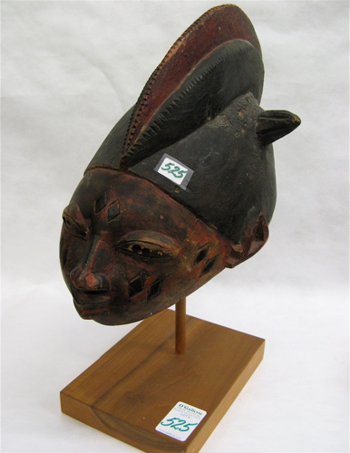 Appraisal: A HAND CARVED WOODEN AFRICAN HELMET attributed to the Ivory