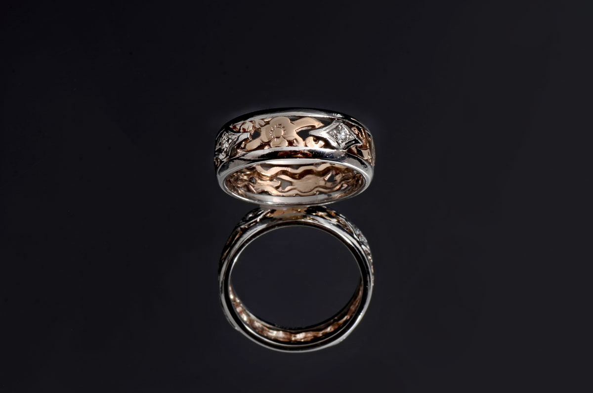 Appraisal: PLATINUM K CELTIC BAND WITH DIAMONDS Celtic design in K