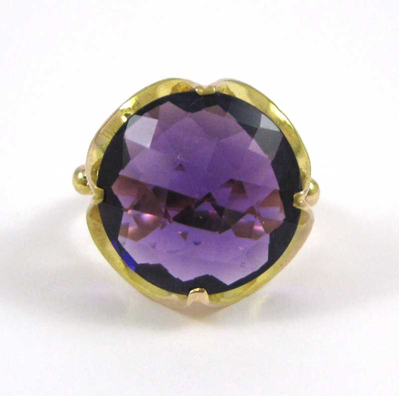 Appraisal: AMETHYST AND FOURTEEN KARAT GOLD SOLITAIRE RING set with a