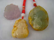 Appraisal: A mixed lot comprising three various Chinese jade pendants largest