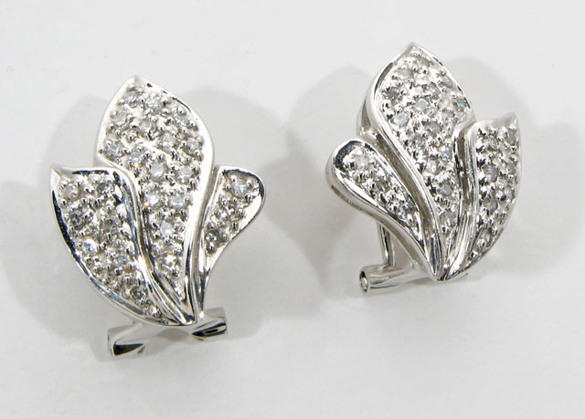 Appraisal: DIAMOND AND FOURTEEN KARAT WHITE GOLD EARRINGS each a stylized