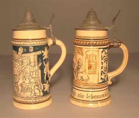 Appraisal: TWO PEWTER MOUNTED GERMAN STONEWARE STEINS with domed hinged covers