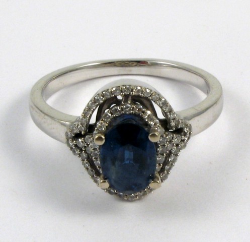 Appraisal: SAPPHIRE AND FOURTEEN KARAT GOLD RING The white gold ring