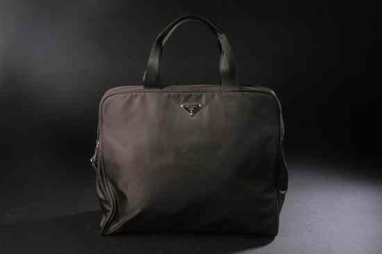 Appraisal: PRADA BROWN NYLON HANDBAG With authentication cards Single compartment interior