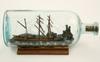 Appraisal: SHIP IN BOTTLE - Three masted schooner ship in bottle