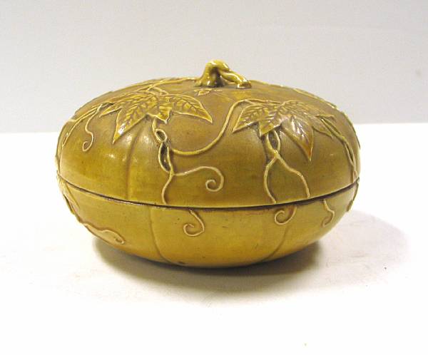 Appraisal: An amber glazed pottery melon form box Of circular section