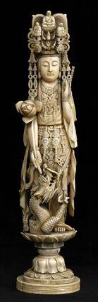 Appraisal: CHINESE CARVED IVORY FIGURE OF KWAN YIN Wearing elaborate headdress