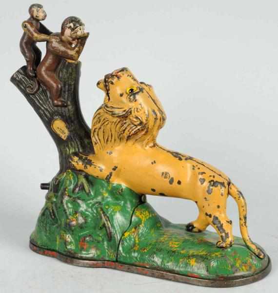 Appraisal: Cast Iron Lion Two Monkeys Mechanical Bank Manufactured by Kyser