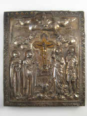 Appraisal: An embossed silver plated icon the orthodox crucifix attended by