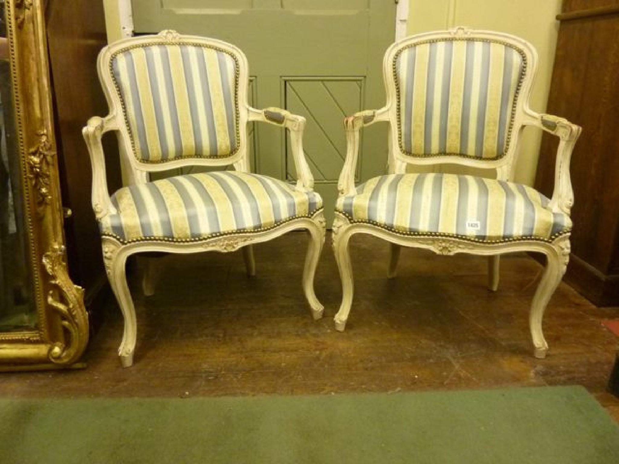 Appraisal: A pair of French style open elbow chairs with serpentine