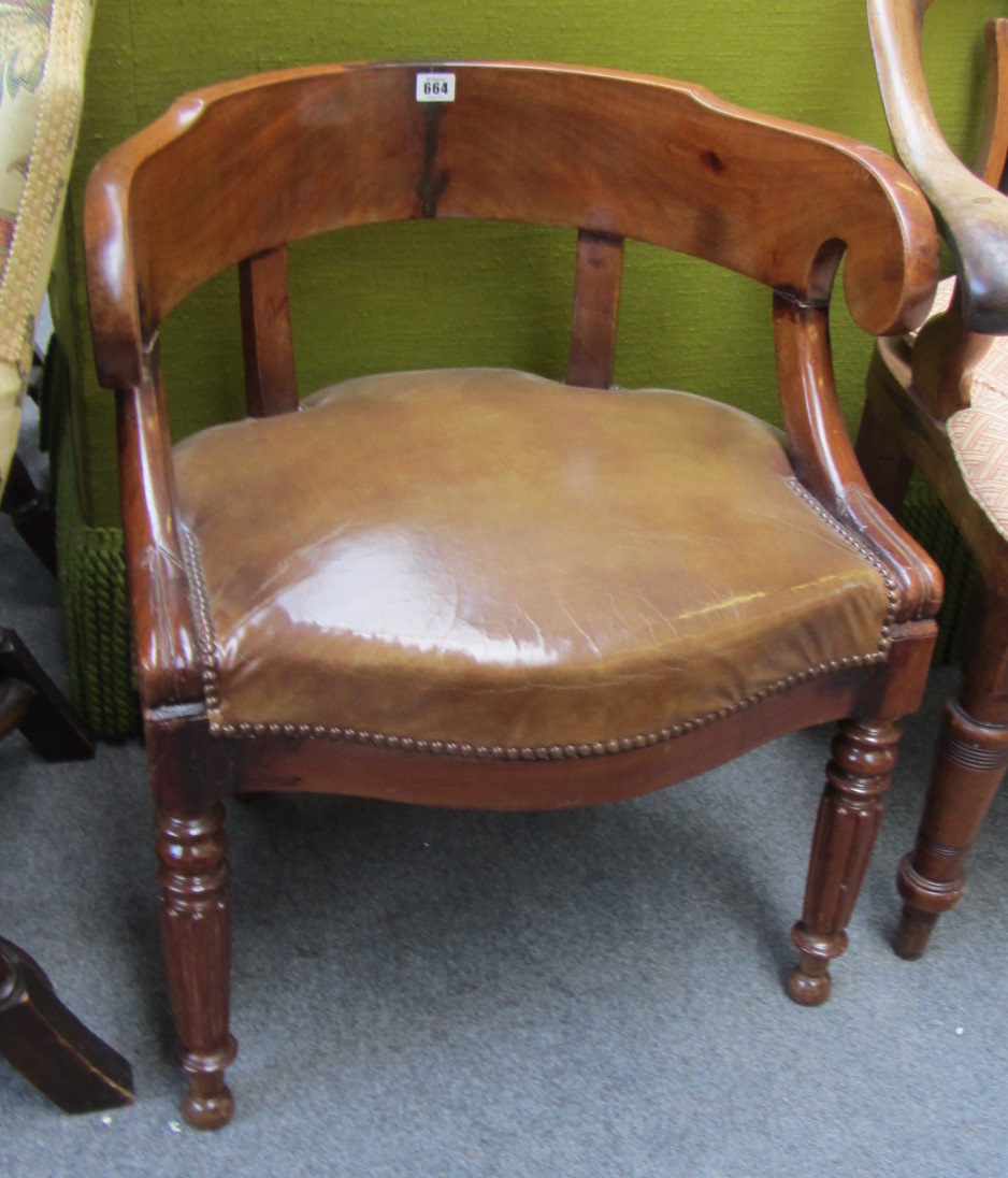 Appraisal: An early th century French mahogany tub back desk chair