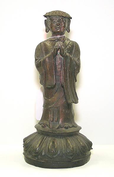 Appraisal: A cast bronze figure of a Buddhist monk The kesa