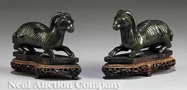 Appraisal: A Pair of Chinese Carved Dark Green Hardstone Figures of