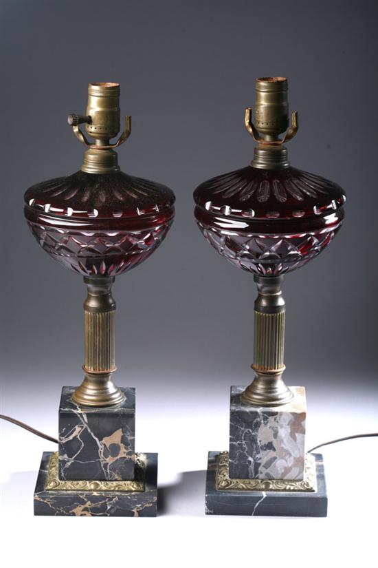 Appraisal: PAIR CONTINENTAL RUBY GLASS AND MARBLE OIL LAMPS late th