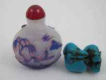 Appraisal: A Chinese double overlay glass snuff bottle the blue over