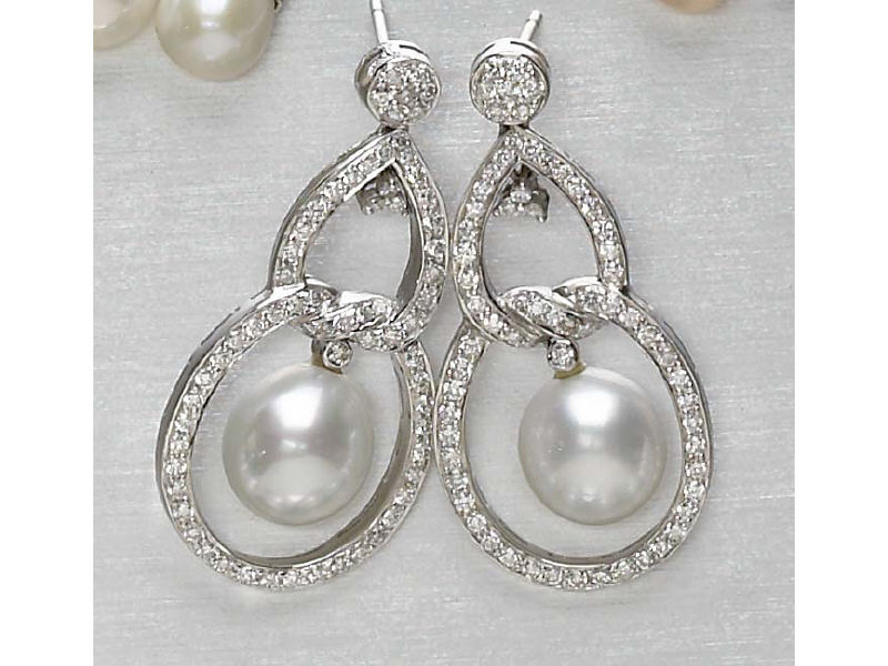 Appraisal: PEARL AND DIAMOND EARRINGS k white gold south sea pearl