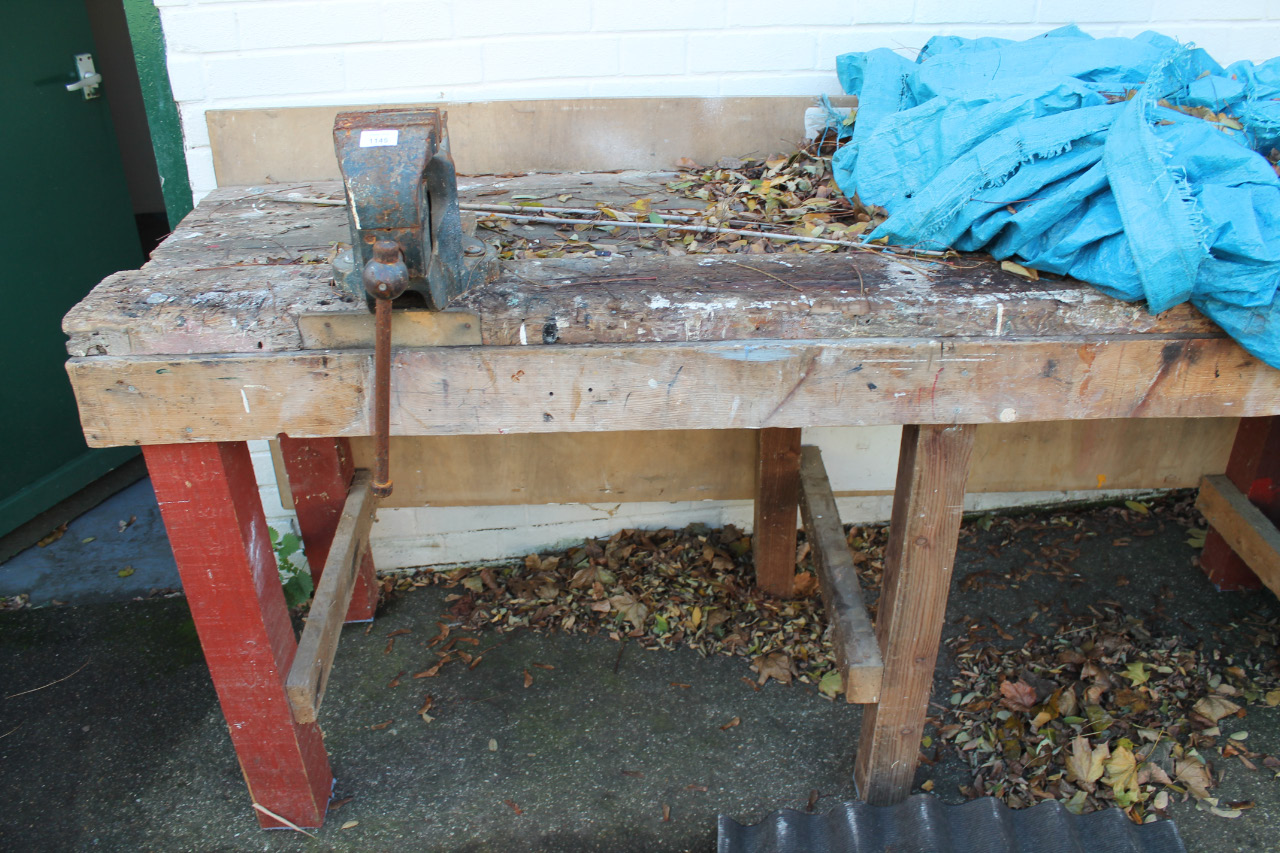 Appraisal: A wooden work bench with mounted vice and an attached