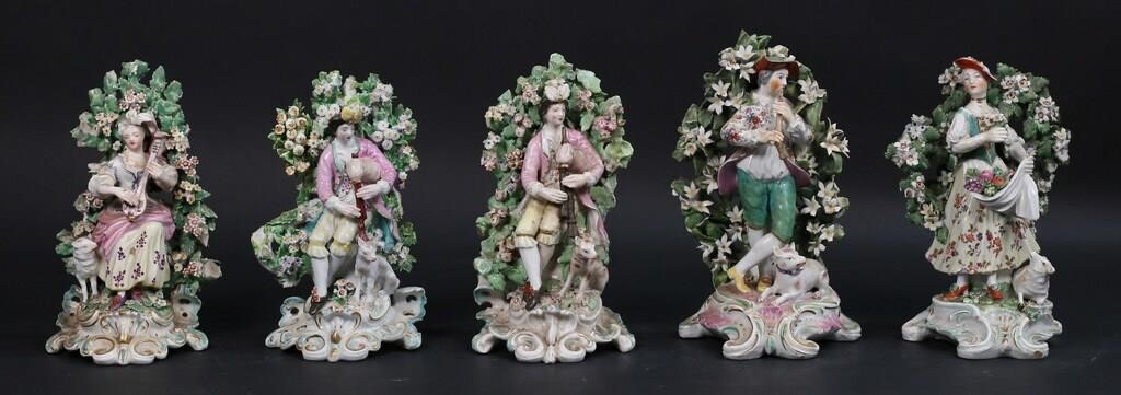 Appraisal: Derby or Chelsea style porcelain figures with bocage backgrounds Tallest