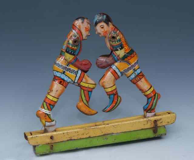 Appraisal: A GERMAN TIN PLATE TOY with articulated action showing a