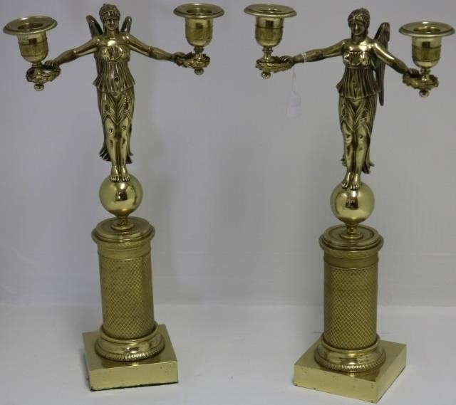 Appraisal: PAIR OF TH C POLISHED BRASS FIGURAL CANDELABRASDEPICTING A STANDING