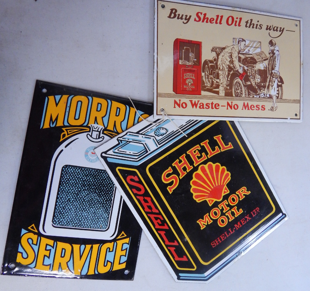 Appraisal: Three reproduction enamel signs comprising Buy Shell Oil This Way