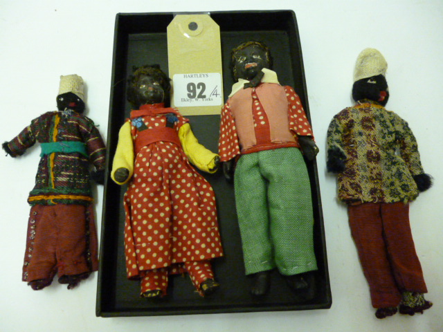 Appraisal: A black composition male doll's house doll and his female