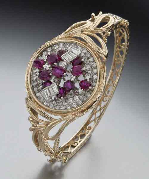 Appraisal: Retro style K gold diamond and ruby banglebracelet having single