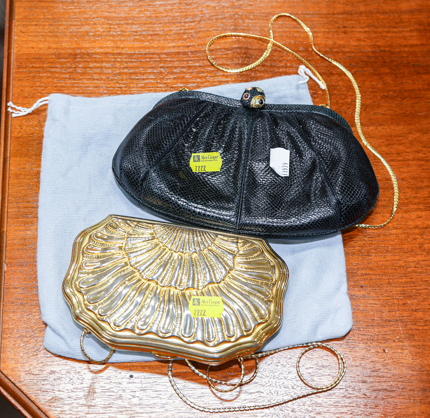 Appraisal: TWO JUDITH LEIBER HANDBAGS Comprising a gilt metal hard-case purse