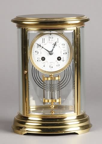 Appraisal: Circa brass and beveled glass case fancy porcelain dial day